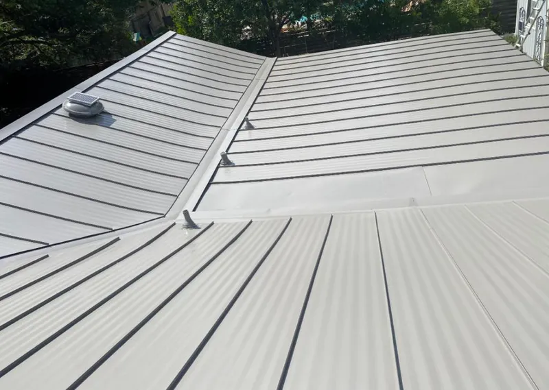 Solar attic fan installed on a metal roof for Roof Ventilation in Sangaree